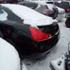 A bunch of cars parked in the snow
