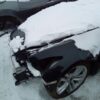A car that has been smashed by the snow.