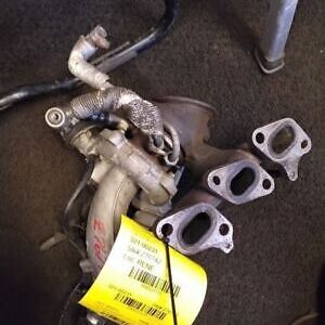 A pair of exhaust manifolds and two other parts.