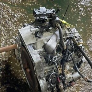 A car engine that is sitting in the water.