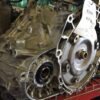 A close up of an engine on the floor