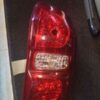 A red car 's tail light is lit up.