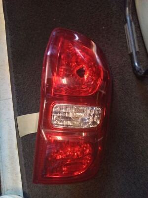 A red car 's tail light is lit up.