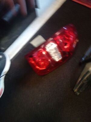 A red light sitting on the floor next to a bicycle.