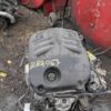 A car engine sitting on top of the ground.