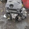 A car engine sitting on top of the ground.