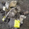 A pile of broken down parts on the ground.