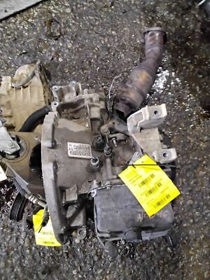 A car engine with some parts on the ground