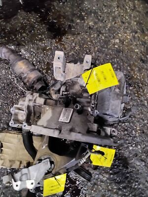 A broken down car with yellow tags on it.