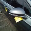 A car with yellow tags on the side of it.