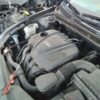 A car engine with the hood open.