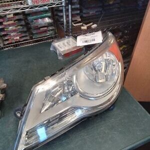 A car headlight sitting on top of a table.