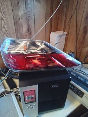 A red car is on top of the computer.