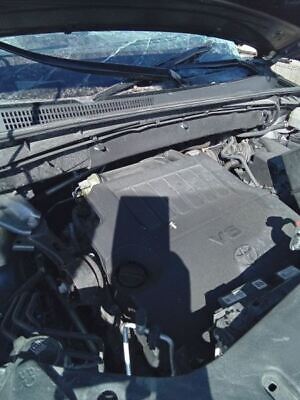 A car engine with the hood open.