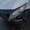 A car that has been smashed in the head.