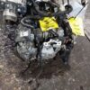 A car engine with some wires attached to it
