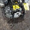 A car engine that is sitting on the ground.