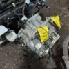 A car engine with two yellow tags on it.