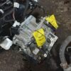 A car engine with some yellow tags on it