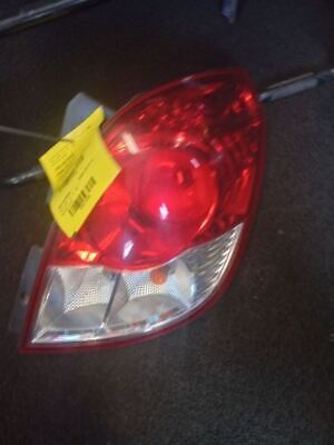 A car 's tail light is shown with the tag on it.