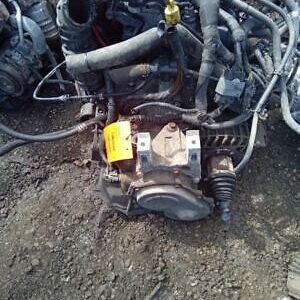 A motorcycle engine is sitting on the ground.