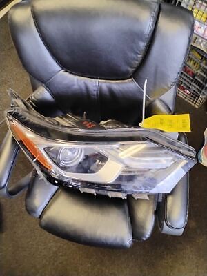 A black leather chair with a headlight in it