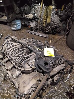 A bunch of old parts that are laying on the ground