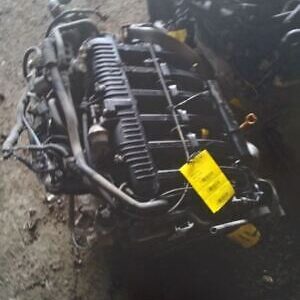 A car engine with some parts missing