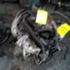 A car engine with many wires attached to it.