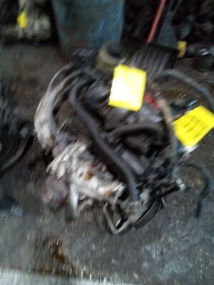 A car engine with many wires attached to it.
