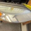 A close up of the side of a car headlight.